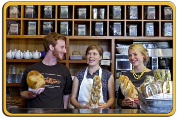 smiling staff working at counter